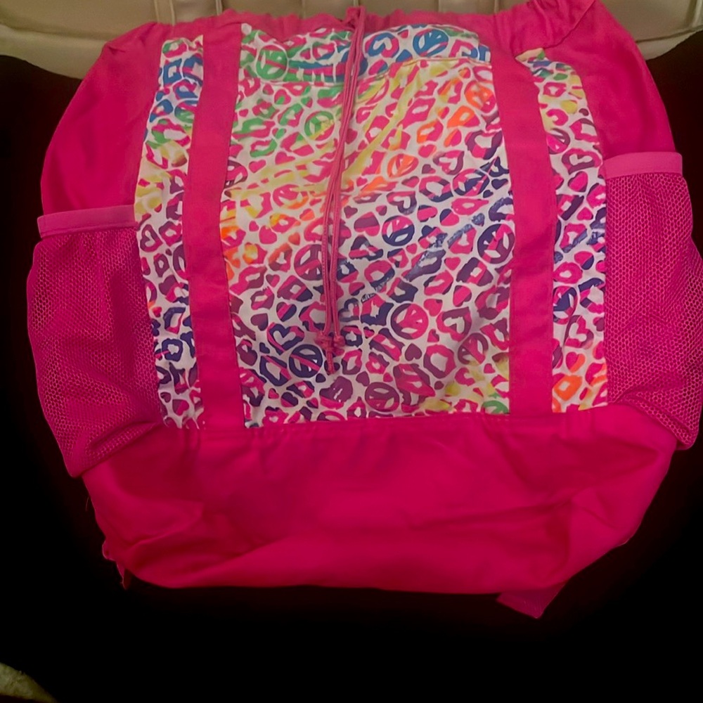 Hot pink girl’s polyester backpack,  drawstring, 2 side pockets.